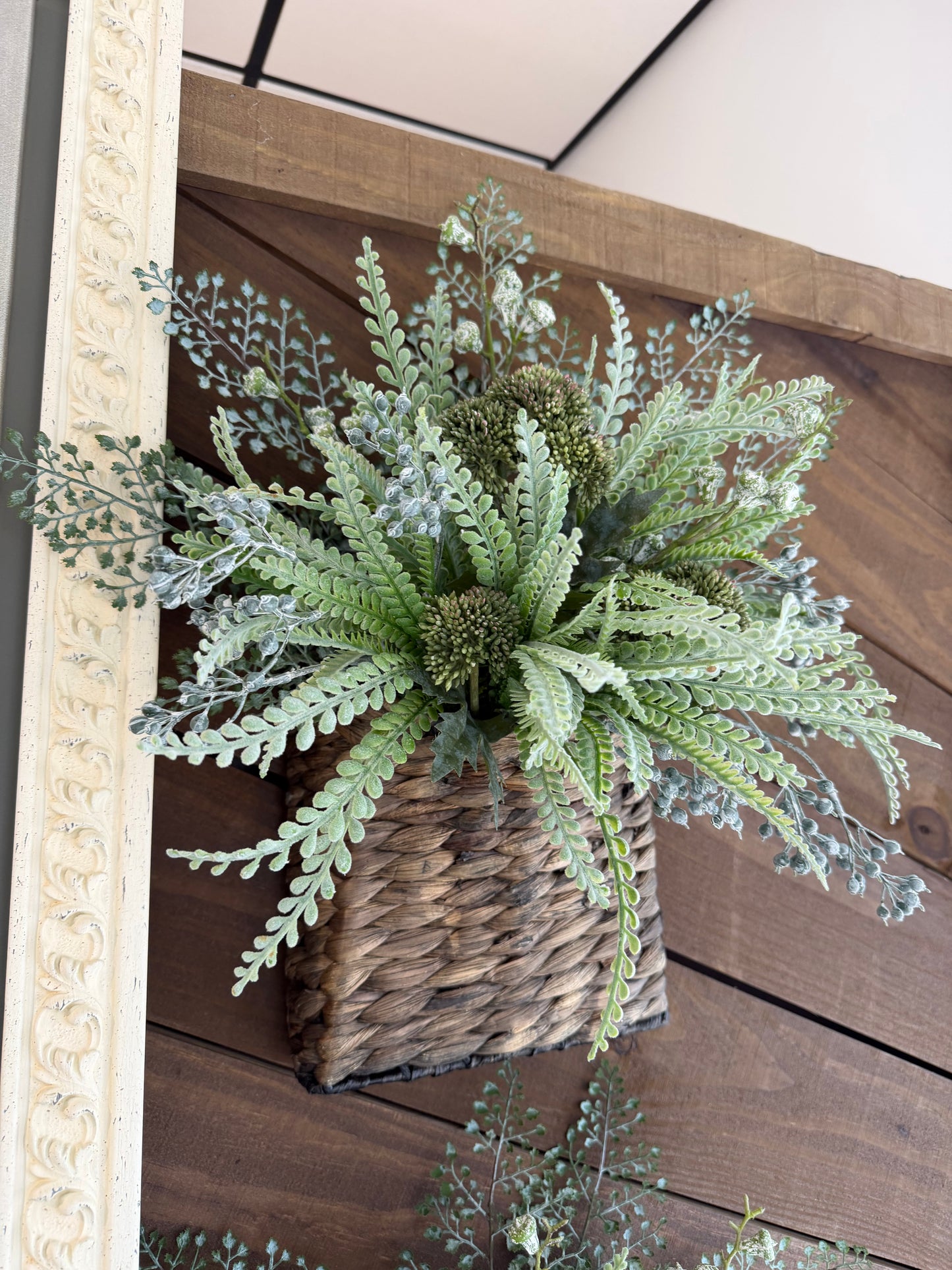 Wall pocket with greenery